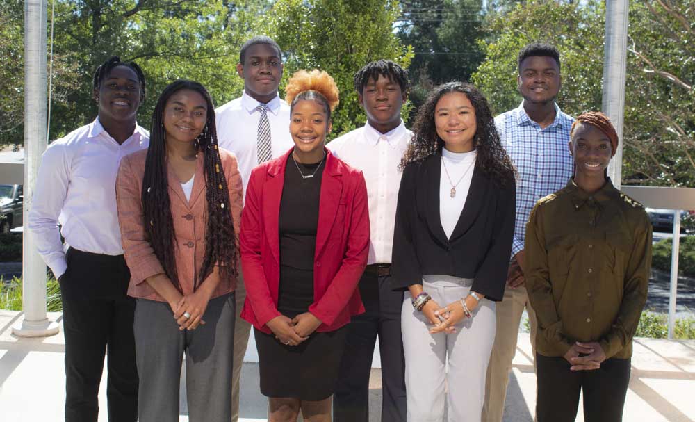two rows of young people smiling 